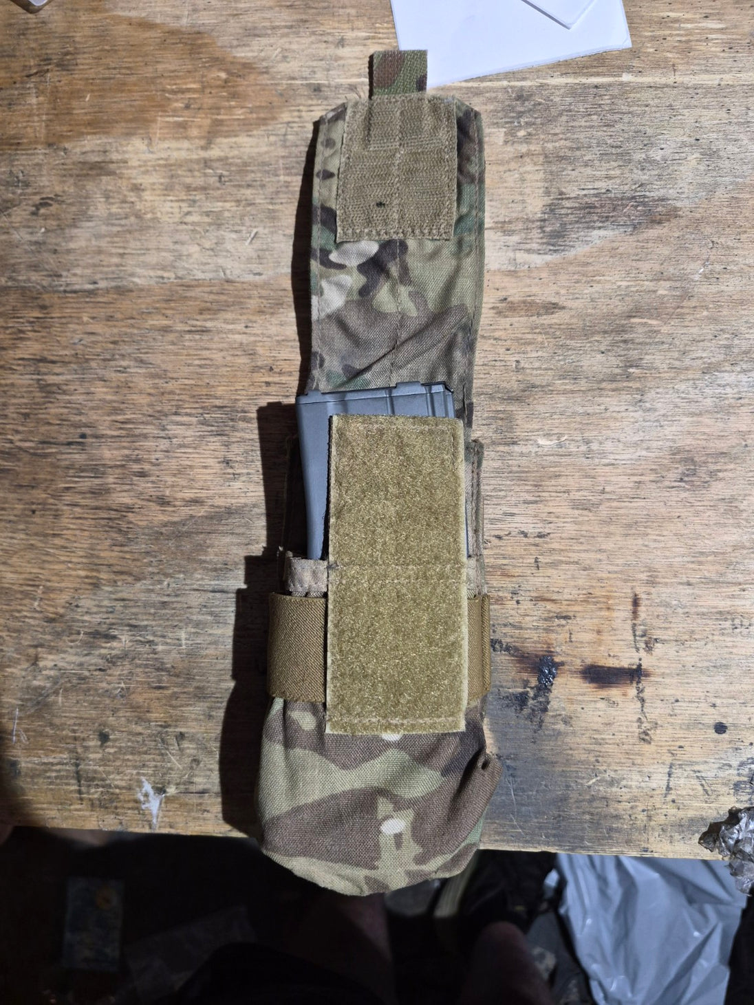 Original fit demonstration with a metal M4-style magazine in the pouch; magazine not included