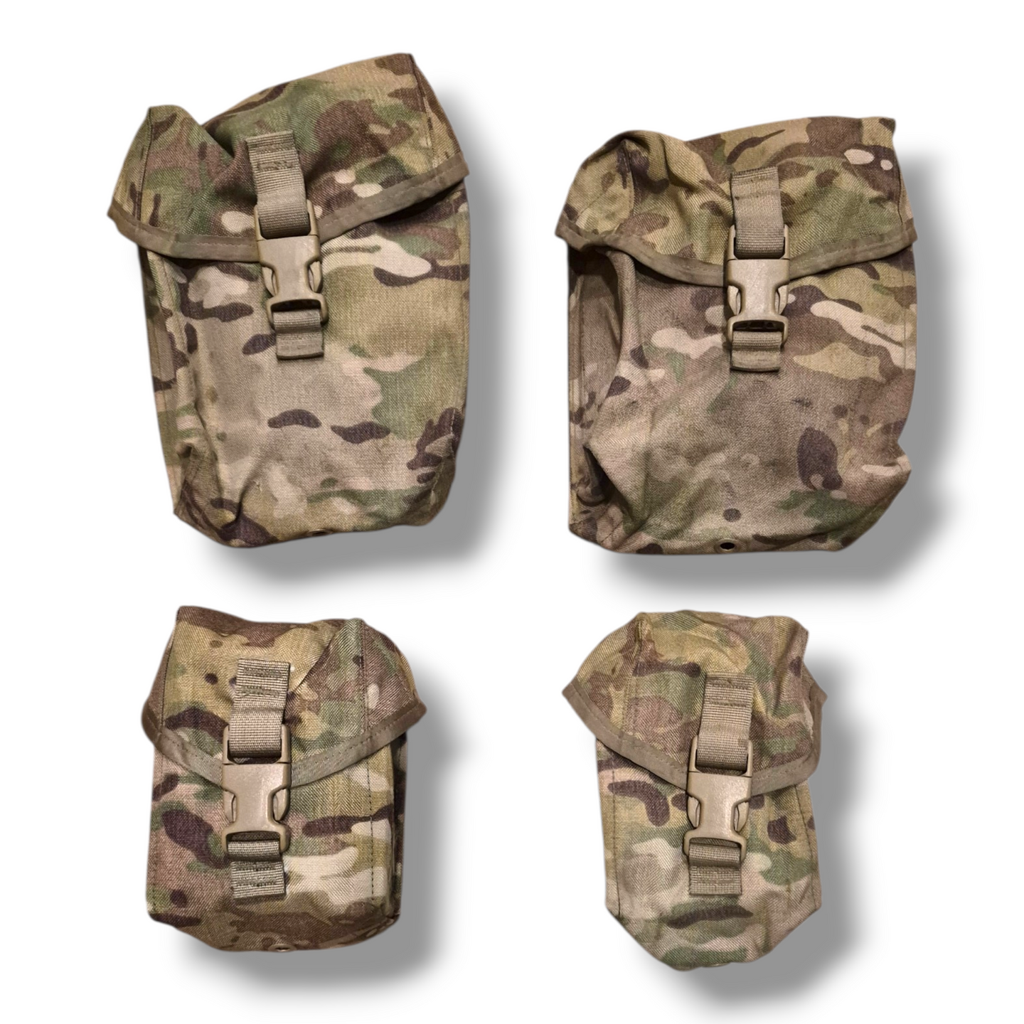 Four multicam military pouches on a white background