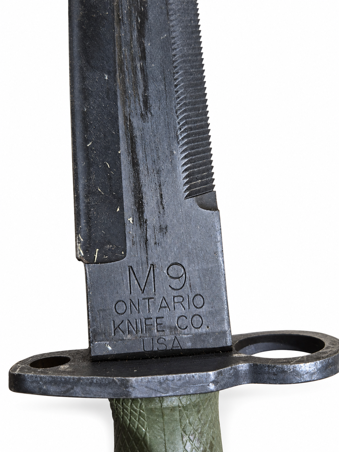 Close-up of M9 Ontario Knife Co. USA blade marking and finish wear.
