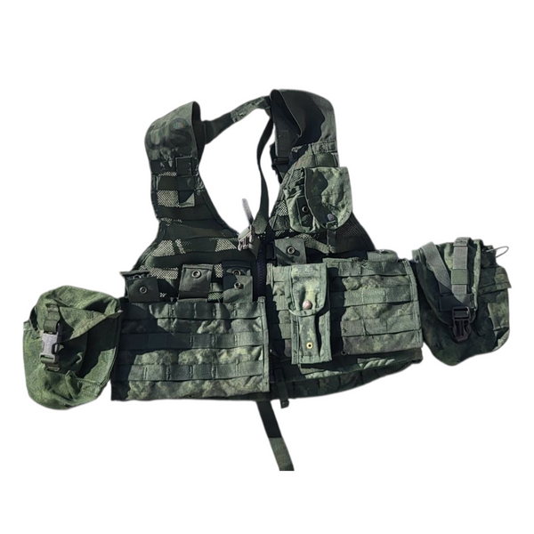 Camouflage tactical vest with multiple pouches on a white background