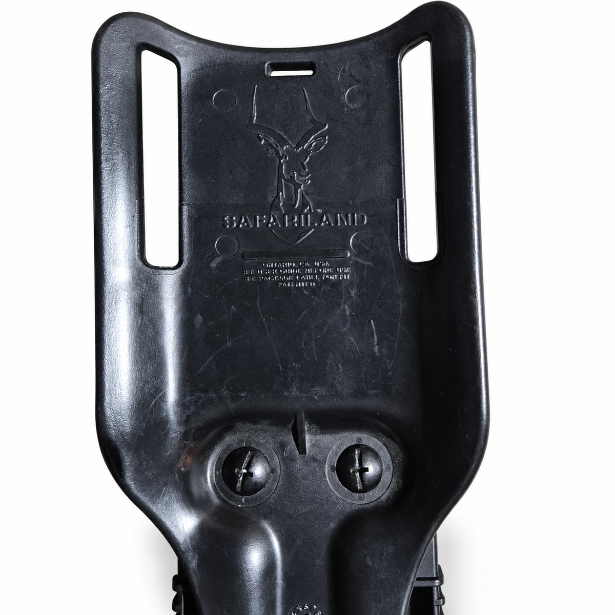 Safariland belt-loop mount closeup showing branding and used surface wear