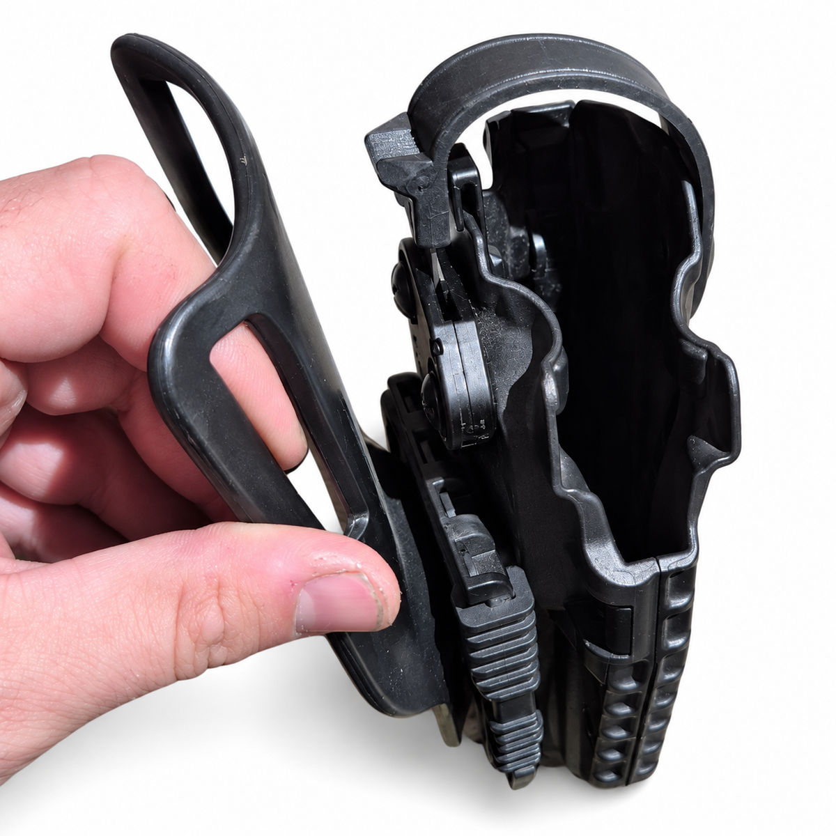 Close view of empty Safariland holster mouth and retention hood